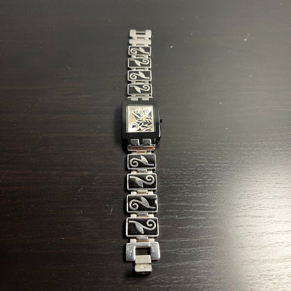 Swatch watch with black floral paterns